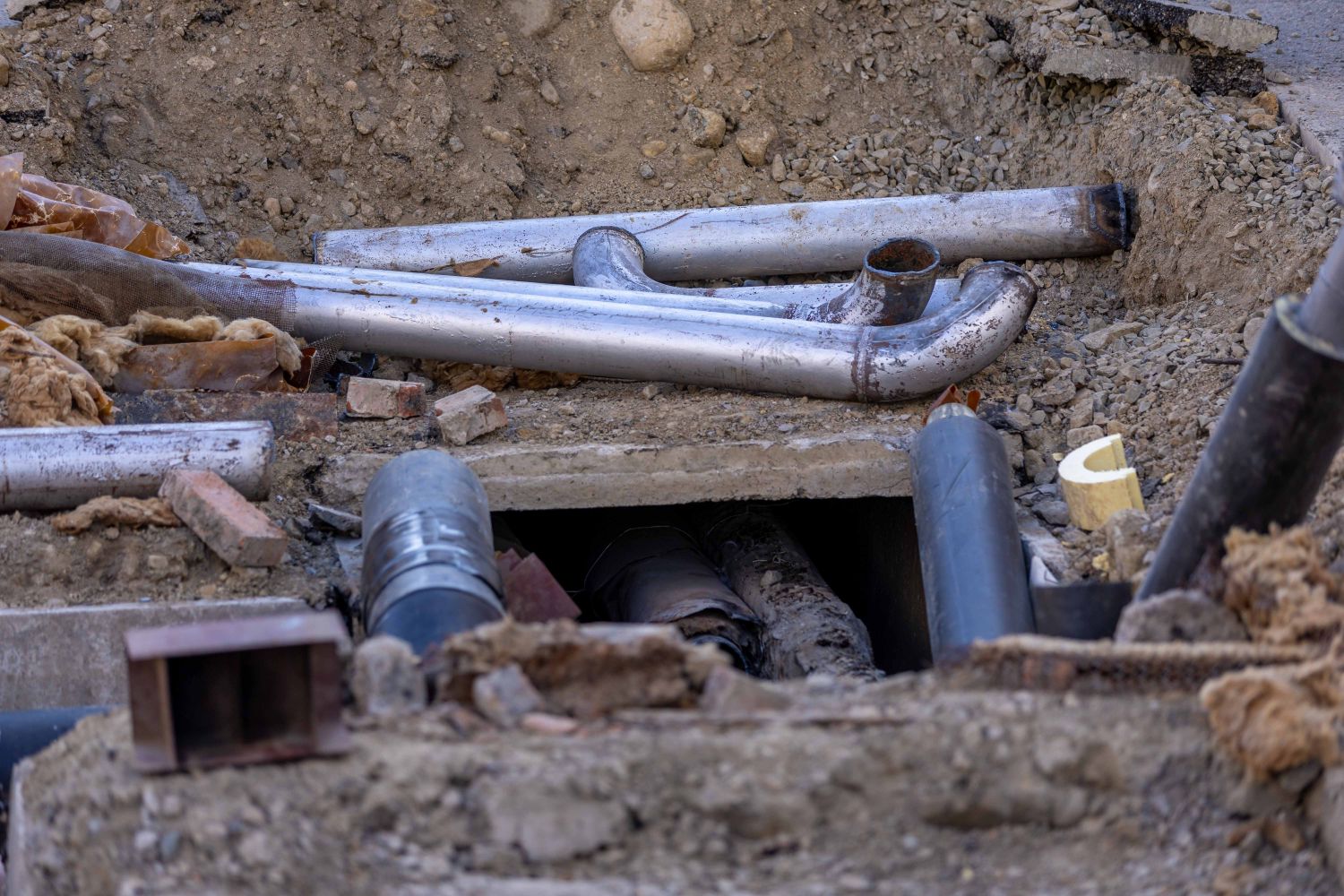Utility pipe laid in an excavated trench